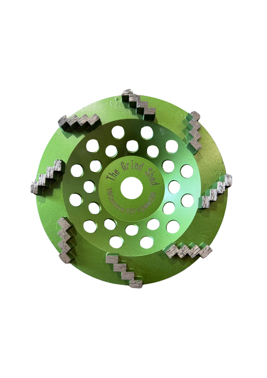 Power through the toughest surfaces with the Grind Shed's 7' Reaper Cup Wheel, Designed for maximum stock removal, this aggressive 10-12 grit wheel chews through high-spots, coatings, and concrete imperfections with speed and precision.