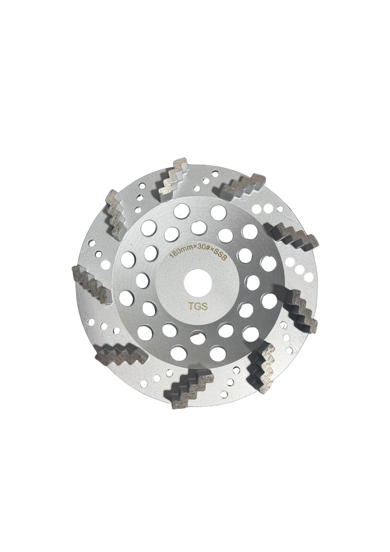 The Grind Shed's 7' Reaper Diamond Cup Wheel is designed for aggressive grinding on very hard concrete surfaces. Featuring zig-zag diamond segments, it delivers fast stock removal with a controlled grind, while the super soft bond ensures the diamonds stay sharp on dense slabs. At 30 grit, it's the ideal tool for heavy preparation and deep scratch removal before moving into finer stages.