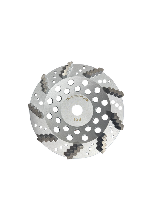 The Grind Shed's 7' Reaper Diamond Cup Wheel is designed for aggressive grinding on very hard concrete surfaces. Featuring zig-zag diamond segments, it delivers fast stock removal with a controlled grind, while the super soft bond ensures the diamonds stay sharp on dense slabs. At 30 grit, it's the ideal tool for heavy preparation and deep scratch removal before moving into finer stages.